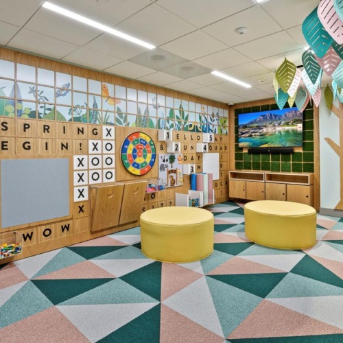 a room with a colorful floor and shelves