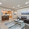 living room with couch coffee table and view of a kitchen