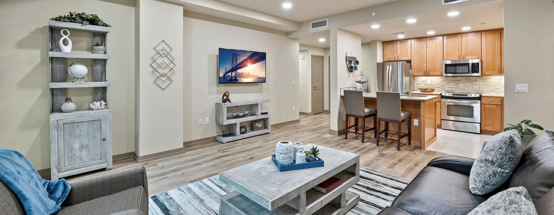 a living room with a tv and couches