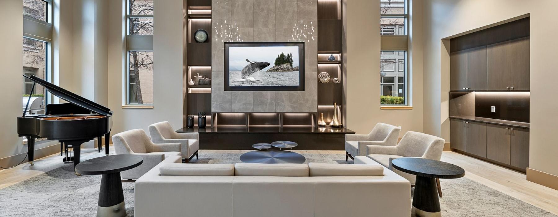 a large living room with a piano